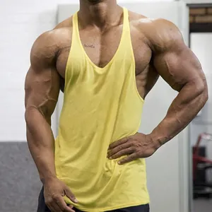 Yellow cotton gym tank top for men showing muscular fit and athletic stringer design