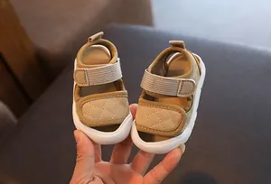 Detailed close-up of khaki baby walking sandals featuring soft soles and quilted patterns.