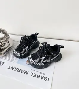 Close-up of black and white patterned children's sports shoes on a fashion magazine
