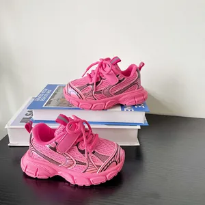 Detail showing pink children's sneakers with mesh upper and thick textured sole