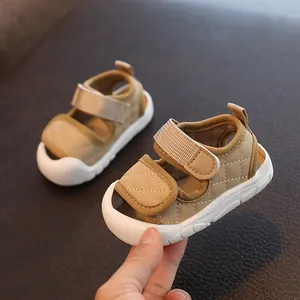 Soft-soled khaki baby sandals with quilted design and anti-slip white rubber bottom