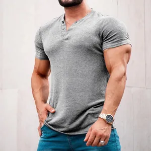 Close-up view of a men's grey slim fit short sleeve Henley shirt with button details