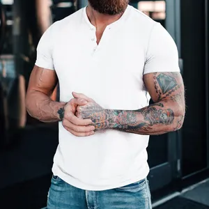 Detail view of a white men's slim fit Henley shirt featuring a buttoned placket.