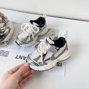 Stylish silver and white toddler sports shoes with soft soles for spring and autumn wear.