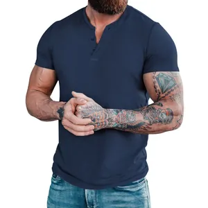 Close-up of navy blue short sleeve men's Henley shirt with buttons on athletic model