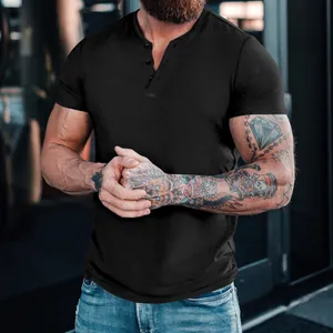 Close-up detail of a black short-sleeved buttoned Henley t-shirt for men