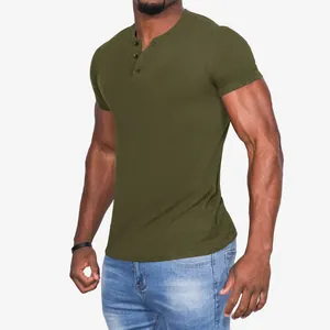 Close-up side view of a muscular male model wearing an olive green slim fit Henley shirt