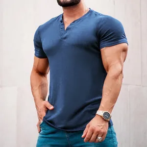 Detail view of a navy blue short sleeve henley shirt featuring a buttoned placket