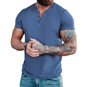 Close-up view of a blue men's short-sleeved casual Henley t-shirt with button neck