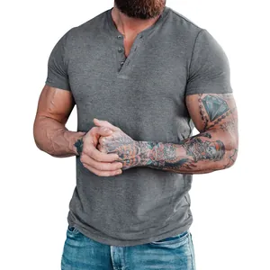 Close-up of men's gray short-sleeve henley shirt with three-button placket detail