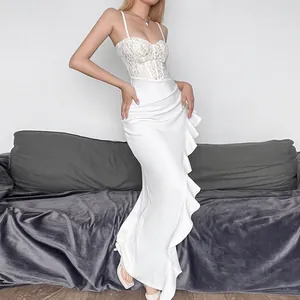 Elegant white lace spaghetti strap maxi dress with ruffled flounced slit detail