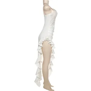 Side view of white lace dress featuring high slit and ruffle trim details.