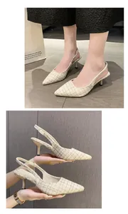 Detail of French style tweed slingback pumps with elegant pointed toe and stiletto heels