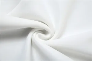 Macro close-up detail of premium soft white dress fabric texture with smooth folds