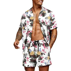 Detail of men's Hawaiian floral short sleeve shirt and shorts set with pineapple print.