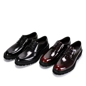 Close-up of glossy patent leather Derby shoes in black and burgundy with chunky soles