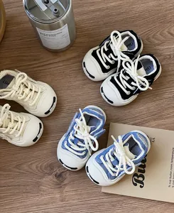 Detailed view of baby canvas sneakers in various colors with soft soles and toe protection