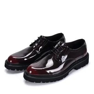 Close-up shot of elegant burgundy patent leather Derby shoes with modern thick black soles