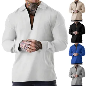Detailed view of men's waffle knit long-sleeve polo shirt with quarter zip in multiple colors