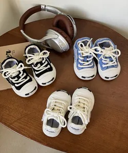 Detail view of colorful toddler canvas shoes with soft soles and thick cotton laces