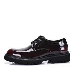 Close-up of glossy burgundy patent leather Derby shoes with thick black lug soles for men