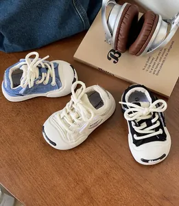 Detailed shot showing three color variants of soft-sole baby canvas walking sneakers.