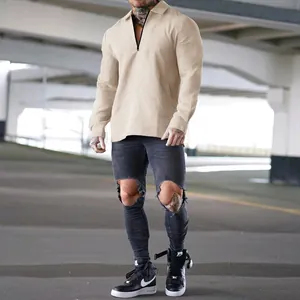 Detailed view of men's heavyweight waffle knit long sleeve polo shirt in beige