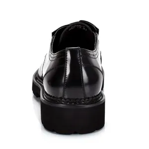 Detailed back view of men's shiny black patent leather derby shoes with thick sole