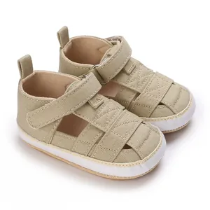 Detailed view of khaki canvas baby shoes featuring soft non-slip rubber soles