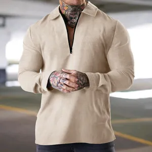 Detailed shot of a men's khaki long-sleeve waffle knit polo shirt with zipper collar
