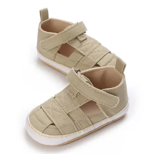Classic khaki canvas baby walking shoes featuring soft non-slip rubber soles for infants