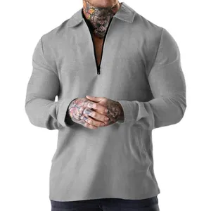 Grey men's waffle knit long sleeve polo shirt featuring a stylish half-zip and lapel collar