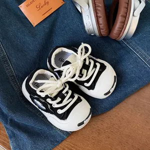 Toddler casual canvas walking sneakers in black and white with soft soles for boys