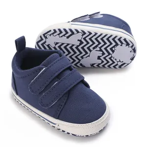 Navy blue infant canvas sneakers with anti-slip zigzag sole detail
