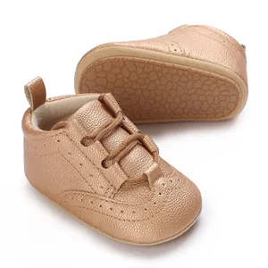 Detailed view of champagne gold baby leather walking shoes with non-slip soft sole