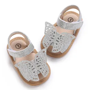 Silver glitter baby sandals with large butterfly detail and soft rubber sole