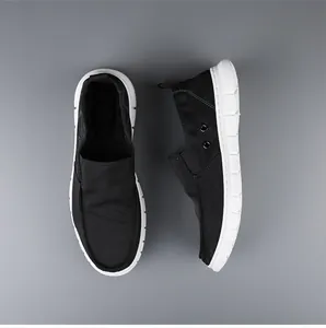 Top and side view of men's black breathable slip-on canvas shoes with white soles