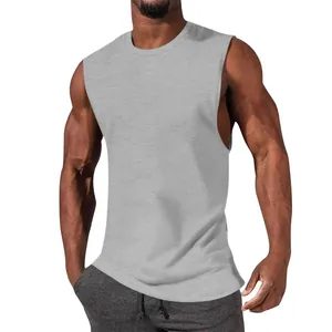 Close-up detail of a grey muscle fit sleeveless tank top worn by an athletic model.