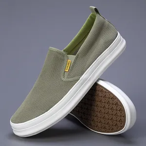 Detailed view of olive green breathable mesh men's slip-on shoes with white sole