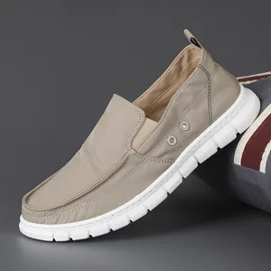 Men's stylish khaki slip-on loafers featuring breathable canvas and flexible soft white soles