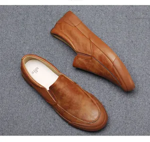 Top view of premium brown men's slip-on loafers featuring soft leather texture