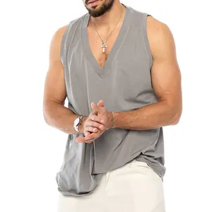 Close-up detail of a men's loose fit cotton tank top featuring a deep V-neck in casual grey