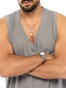 Close-up of a men's loose-fit grey cotton tank top worn by a model in a casual style