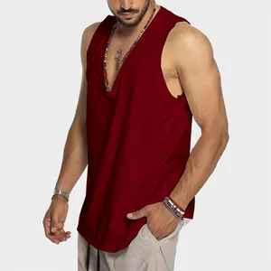 Men's deep V-neck burgundy cotton tank top with a relaxed fit, shown on a model.