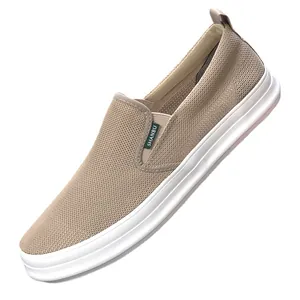 Men's breathable khaki mesh slip-on sneakers featuring comfortable thick white soles