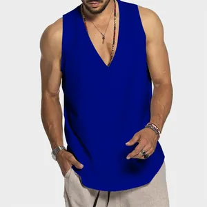 Macro detail view of men's sleeveless deep V-neck blue cotton tank top worn on model