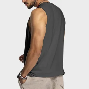 Side-back view of a men's loose cotton tank top in dark grey for summer sport activities.