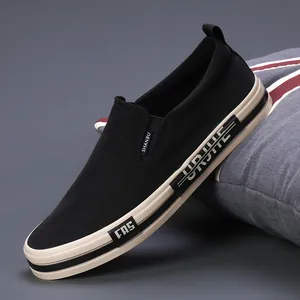 Modern black men's casual slip-on loafers with comfortable thick beige rubber soles