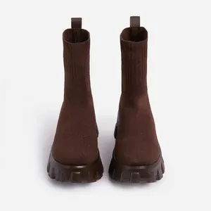Front view of stylish brown breathable knit sock boots with thick platform lug soles.