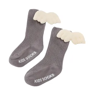 Comfortable grey ribbed baby socks featuring cute angel wings and anti-slip grip soles